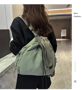 Casual nylon backpack with large capacity, drawstring closure, and comfortable wide shoulder straps.