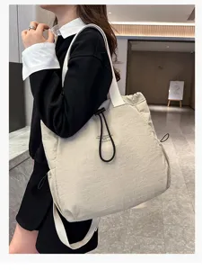 Stylish large capacity nylon backpack casual commuter school bag for women daily use.