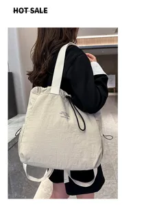 Detail view of casual nylon backpack with drawstring design and spacious daily storage capacity.