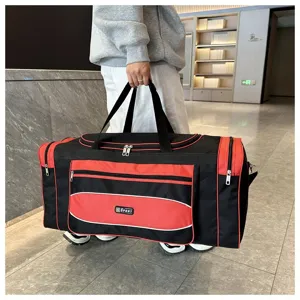 Grand sac de voyage noir et rouge, sac de sport durable avec plusieurs poches zippées.
