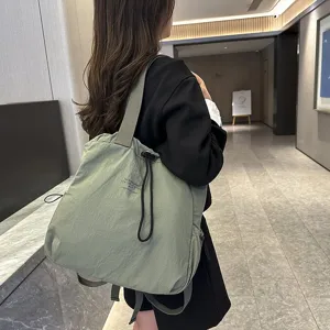 Casual nylon backpack with large capacity, trendy lightweight school bag for students.