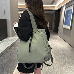 Detail view of large capacity nylon backpack, casual commuter daypack for daily school use.
