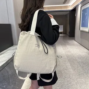 Casual nylon tote backpack large capacity stylish daypack for daily commute and school use.