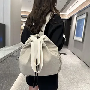 Detail view of the casual nylon backpack, showcasing its large capacity and drawstring design.