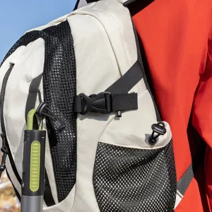 Close-up macro detail of a hiking backpack with mesh side pocket and durable buckle