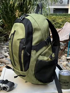 Durable green hiking backpack for outdoor trekking and travel shown in a natural scene