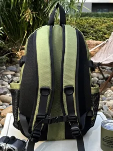 Detailed view of breathable padded back system and adjustable straps on green hiking backpack