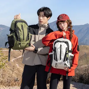 Lightweight green and white outdoor hiking backpacks shown in a mountain scene