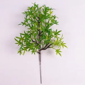 Realistic artificial green pine branch for decorative floral arrangements.