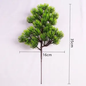 Detailed macro view of 35cm artificial pine branch with green needles and size markers