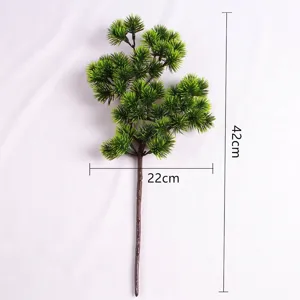 Detailed view of artificial pine branch with 42cm height and 22cm width dimensions