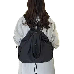 Casual black nylon backpack for women, large capacity commuter school bag with drawstring.