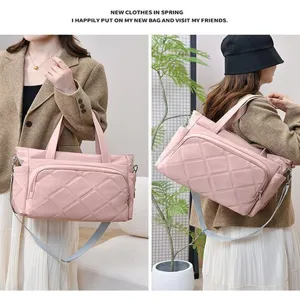 Stylish large capacity solid color quilted tote bag, versatile travel shoulder bag for women.