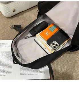 Large capacity black backpack for daily commute and students, spacious interior for essentials.