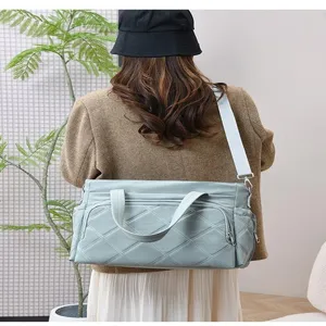 Detailed view of the large capacity quilted tote mommy bag with comfortable straps.