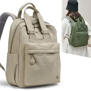 Casual nylon backpack for women with dual top handles, front pocket, and daily travel use.