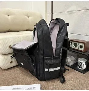 Detail view of black camo multi-compartment backpack with large capacity for daily commuting.