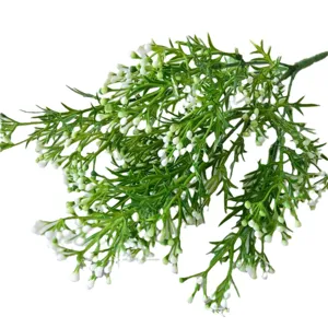 Lifelike artificial green grass branch with small white flowers for garden decor