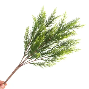 Realistic artificial pine needle branch greenery for Christmas and wedding decoration.