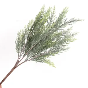 Close-up view of artificial green pine needles branch for holiday decoration