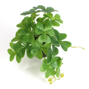 High-quality detailed view of artificial mini monstera potted plant for indoor home decoration