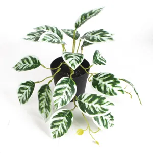 Close-up detail of artificial watermelon leaf potted plant for modern home decoration