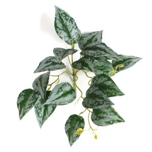 Close-up of artificial watermelon leaves with realistic silver-grey marbled patterns