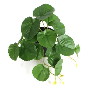 Detailed overhead view of 3D printed artificial watermelon begonia leaves in pot