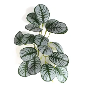 Detailed macro view of a 3D printed artificial watermelon leaf branch for home decor