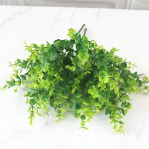 Detailed top-down view of artificial eucalyptus stems with vibrant green leaves