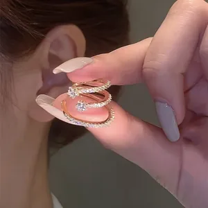 Elegant multi-layer gold ear cuff with sparkling cubic zirconia, no piercing needed.