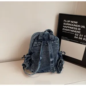 Sac à dos en denim décontracté pour femme, cartable vintage lavé avec multiples poches.