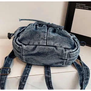 Sac à dos en denim élégant pour femme, sac vintage décontracté avec cordon de serrage.