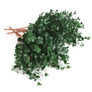 Detailed view of lush green artificial eucalyptus bouquet for home decor.