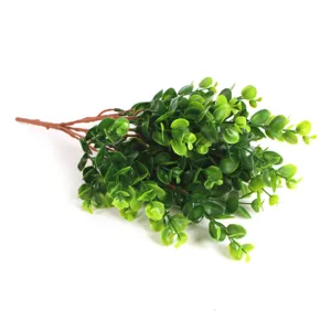Artificial eucalyptus branch detail, frosted green money leaves, realistic plant decor for home.