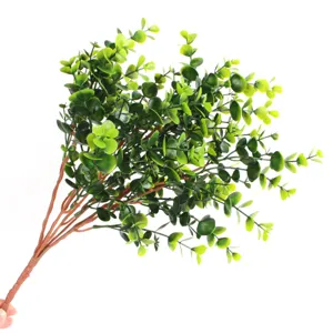 Detailed close-up view of realistic green artificial eucalyptus money leaf plant bunch