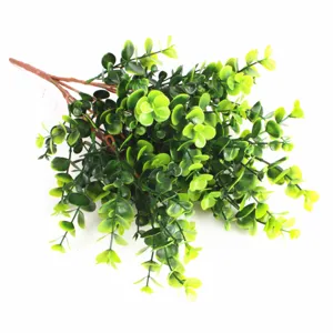 Macro view of lush artificial eucalyptus money leaf bouquet with green foliage