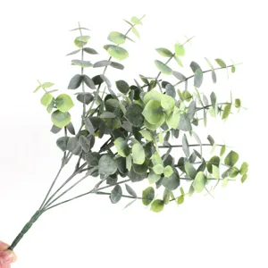Detailed view of realistic artificial eucalyptus stems with green leaves for home decor