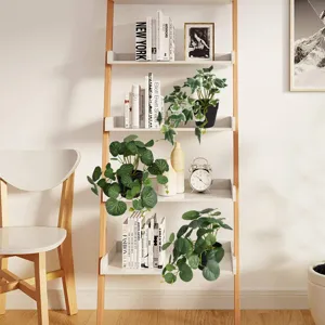 Three lifelike artificial potted plants displayed on a modern wooden bookshelf for home decor