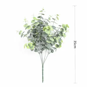 Detailed view of an artificial eucalyptus leaf bundle with a 35cm height measurement scale