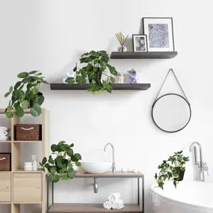 Detailed view of artificial potted plants arranged in a modern bathroom decor