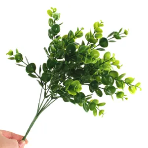 Artificial eucalyptus leaf detail shot, frosted green money plant branch for home decor.
