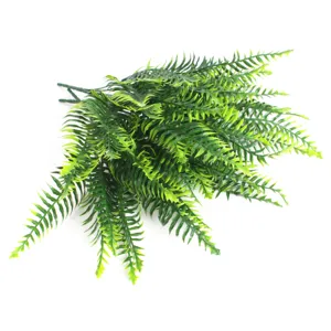 Artificial fern plant detail shot, realistic green plastic foliage for home floral arrangement decor.