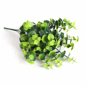 Detail shot of artificial eucalyptus bouquet showing realistic green money leaves