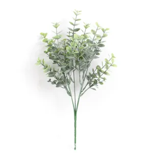 Detail view of artificial eucalyptus bouquet with frosted green leaves for home decor.