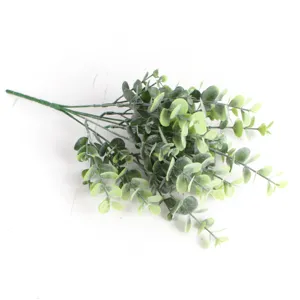 Close-up of realistic artificial eucalyptus money leaf bouquet for home interior decoration.