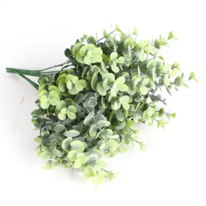 Close-up detail showing the realistic textures of artificial green eucalyptus leaves