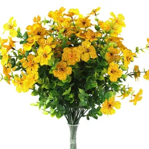 Detailed macro shot of artificial yellow flowers featuring realistic brown petal veins