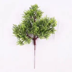 Detailed view of 35cm artificial pine branch with green foliage and brown stem