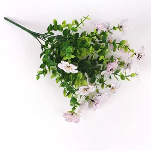 Detailed view of artificial eucalyptus and violet bouquet with white purple-veined petals